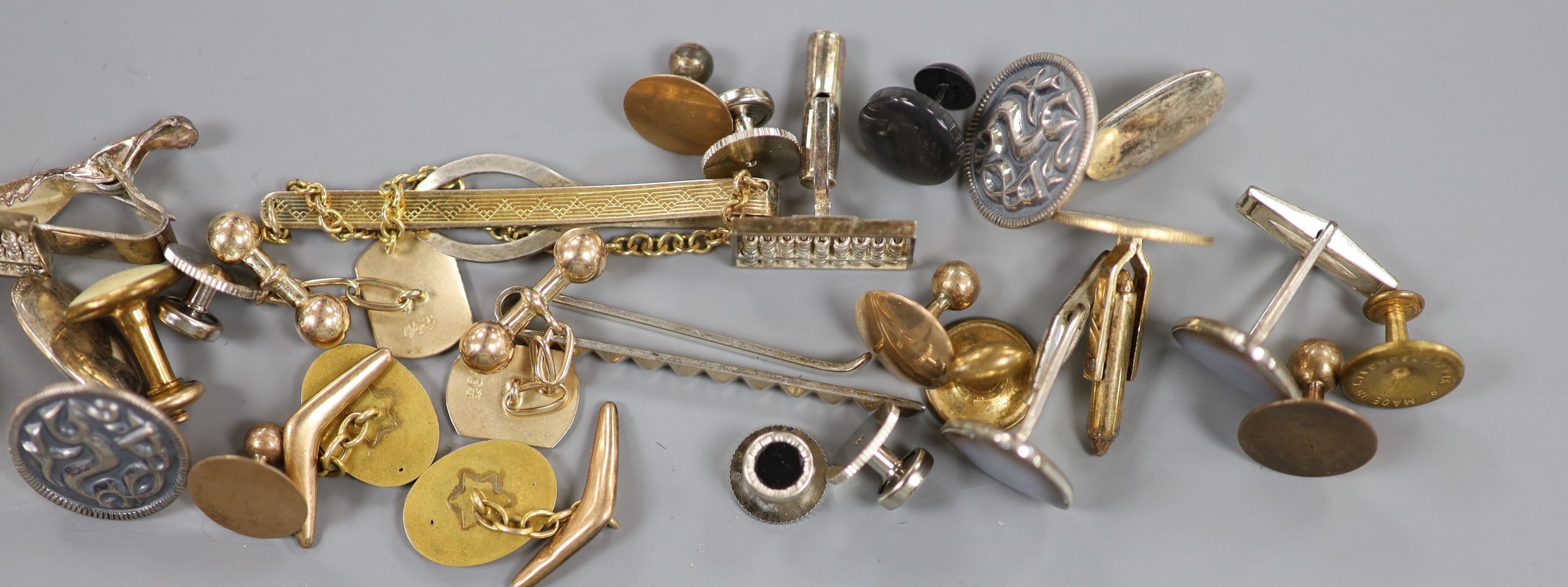 Two 15ct dress studs, 2.8 grams, a 10ct dress stud 0.7 grams, a 9ct gold dress stud 0.7 grams and a group of sundry cufflinks etc.